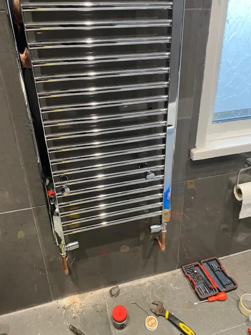 Heated towel rail installation